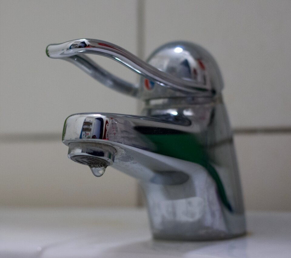 Water bathroom faucet dripping tap