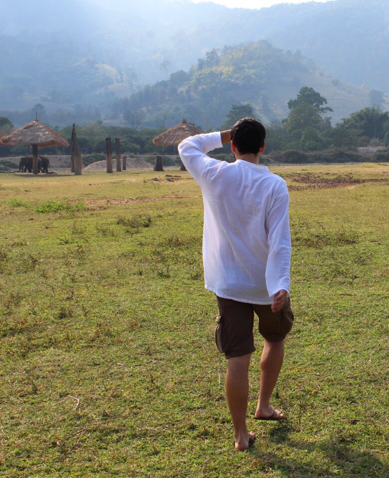 Hiking back view white shirt