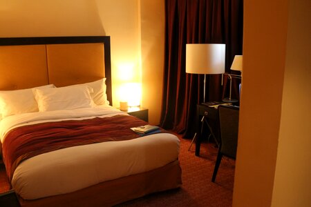 Comfortable brown bed brown hotel photo