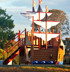 Yellow white sails ship's hull photo