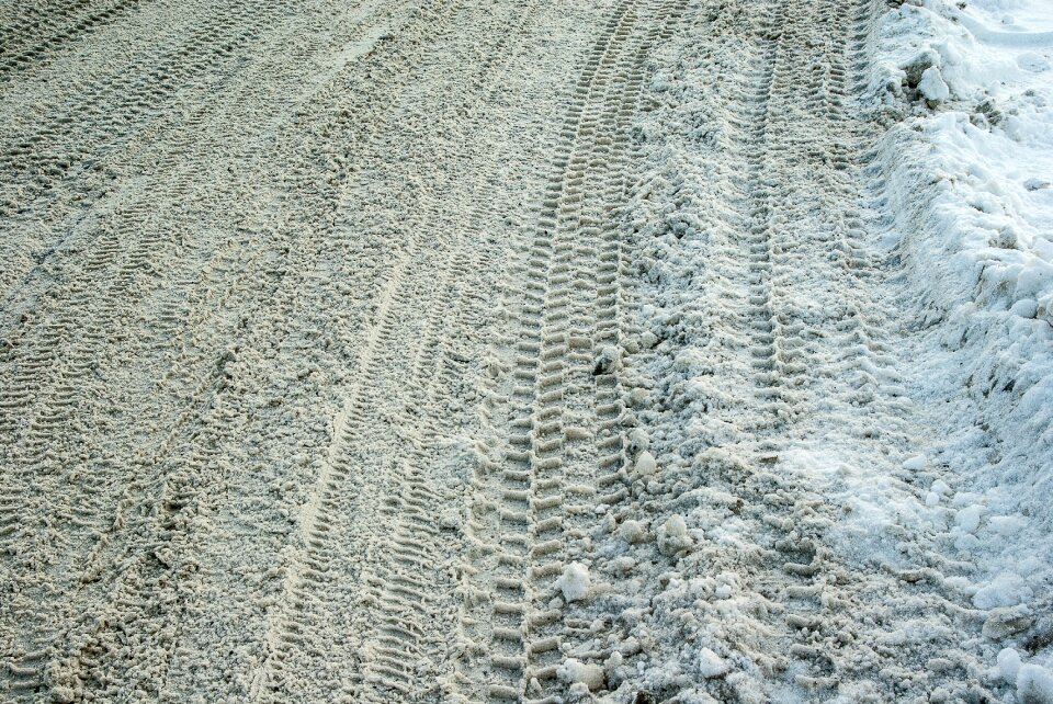Snow tire tracks icy road