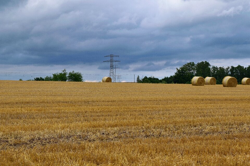 Power line sky straw bales