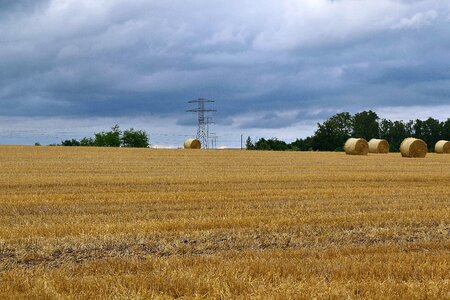 Power line sky straw bales