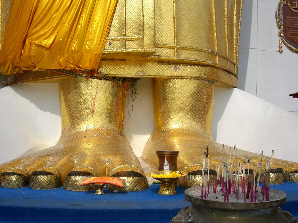 Buddha statue toes incense