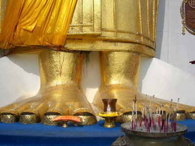Buddha statue toes incense