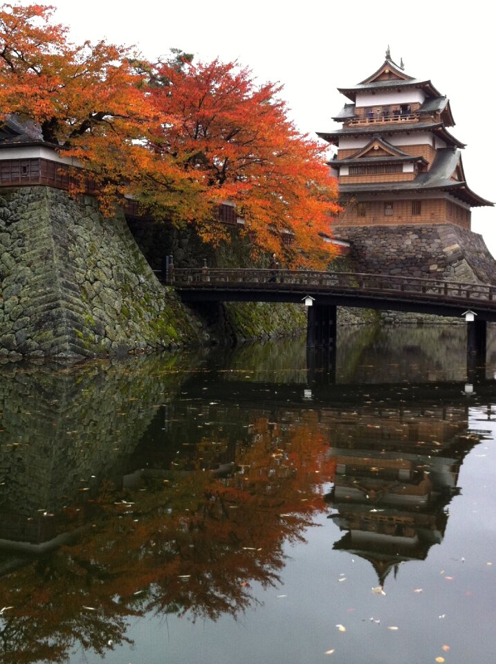 Autumnal leaves castle gate water