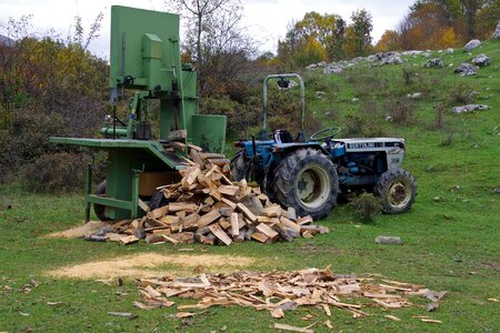 Power saw lumber trunks of trees