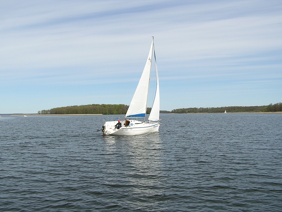 Lake loneliness a lonely white sail