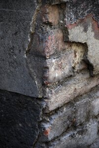 Broken plaster stone wall photo