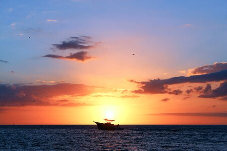 Boat tropical beach sunset photo