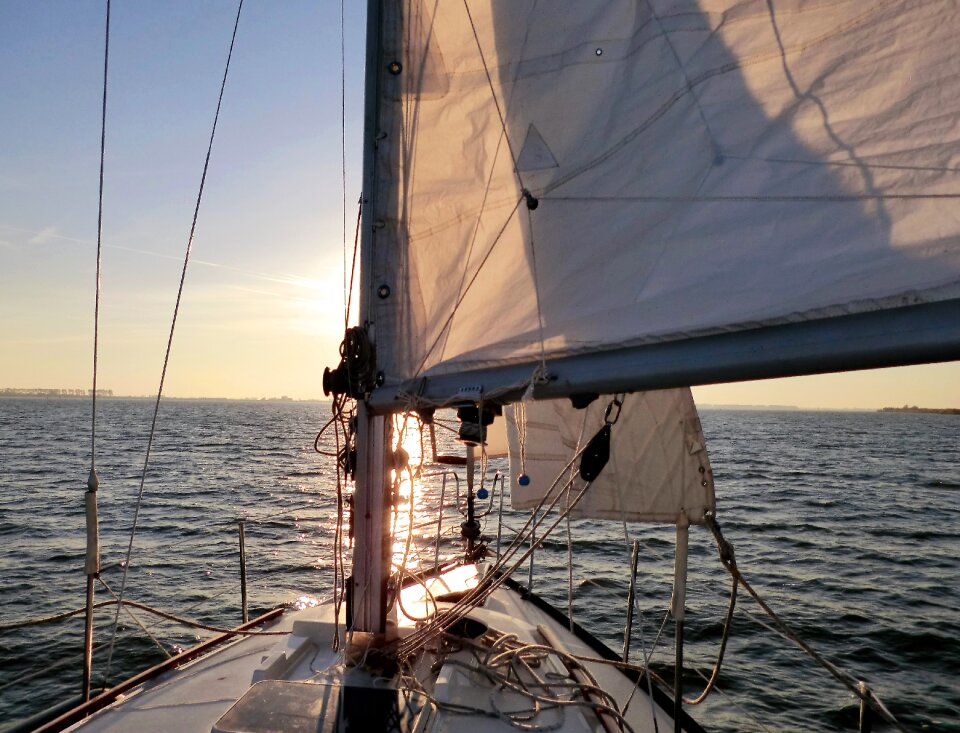 Sunset wind sailing boat