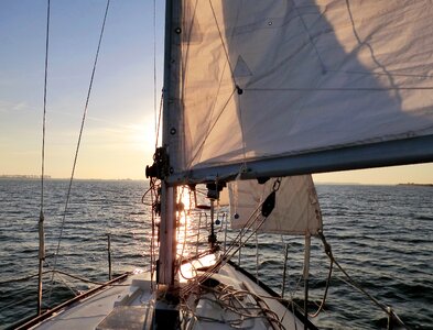 Sunset wind sailing boat