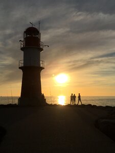 Dusk coast lighthouse evening sun