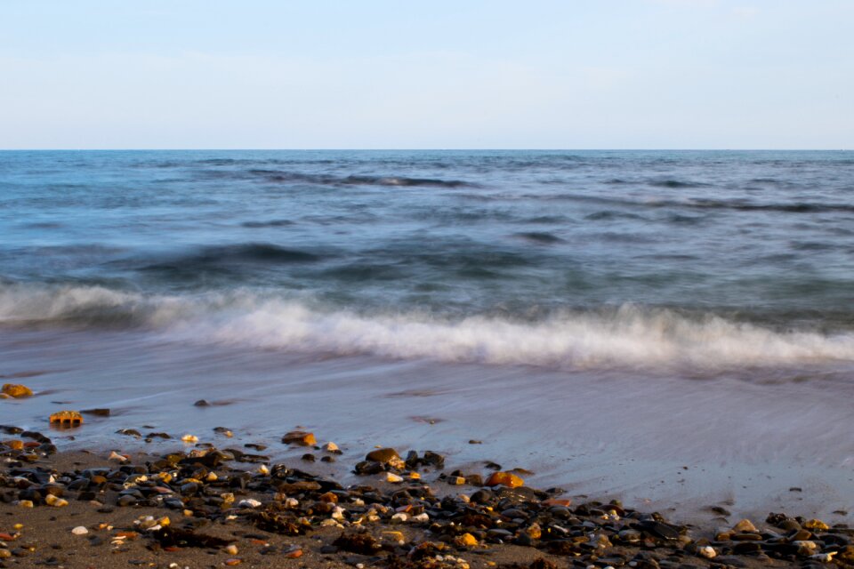 Waves sand stones photo