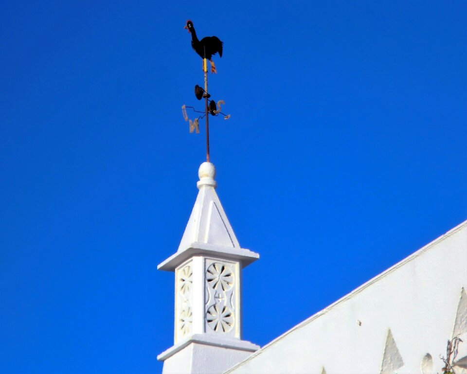 Portugal blue sky wind cock photo