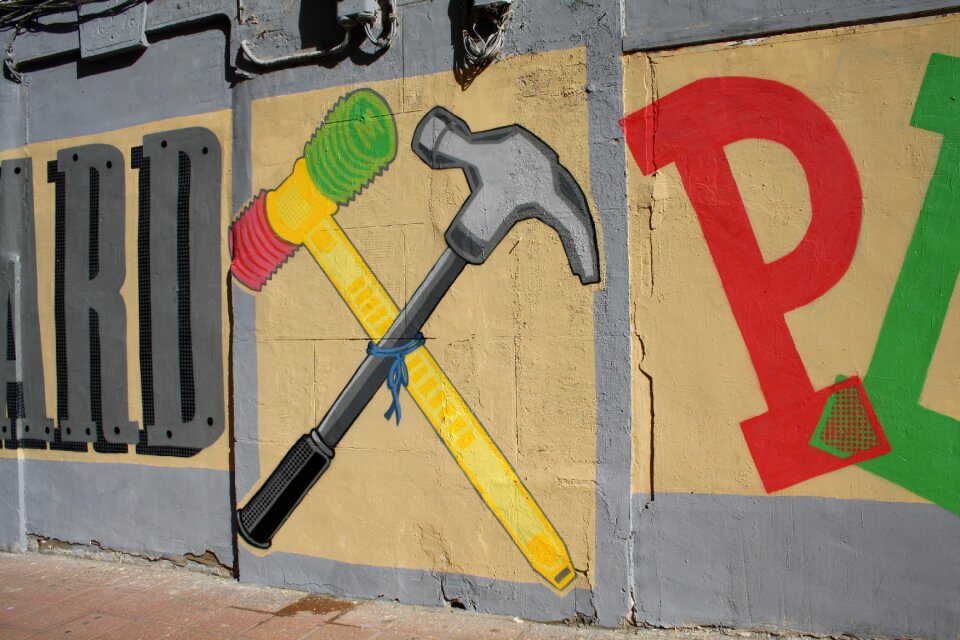 Hammer painting wall