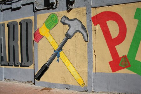Hammer painting wall