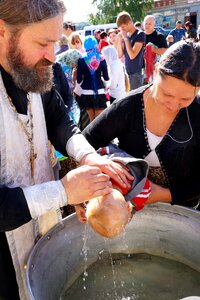 Boy woman orthodox priest photo