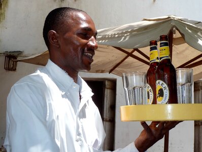Tanzania drinking beer work photo