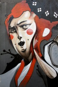 Women painting wall
