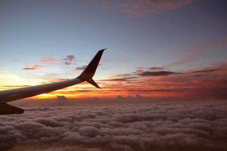 Clouds dawn aircraft photo