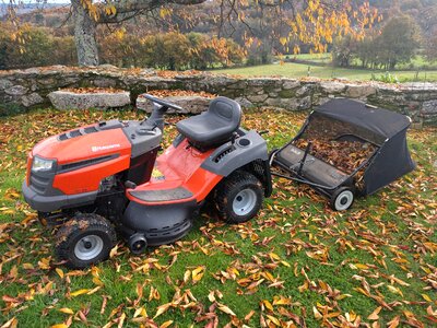 Tractor lawn mower picks up leaves