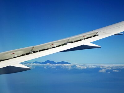 Blue sky cloud plane photo