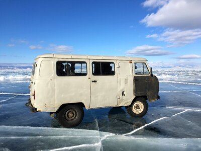 Old car ice a frozen lake photo
