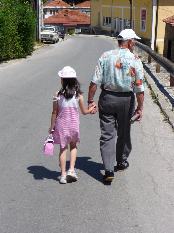 Hold hands walk bsck view