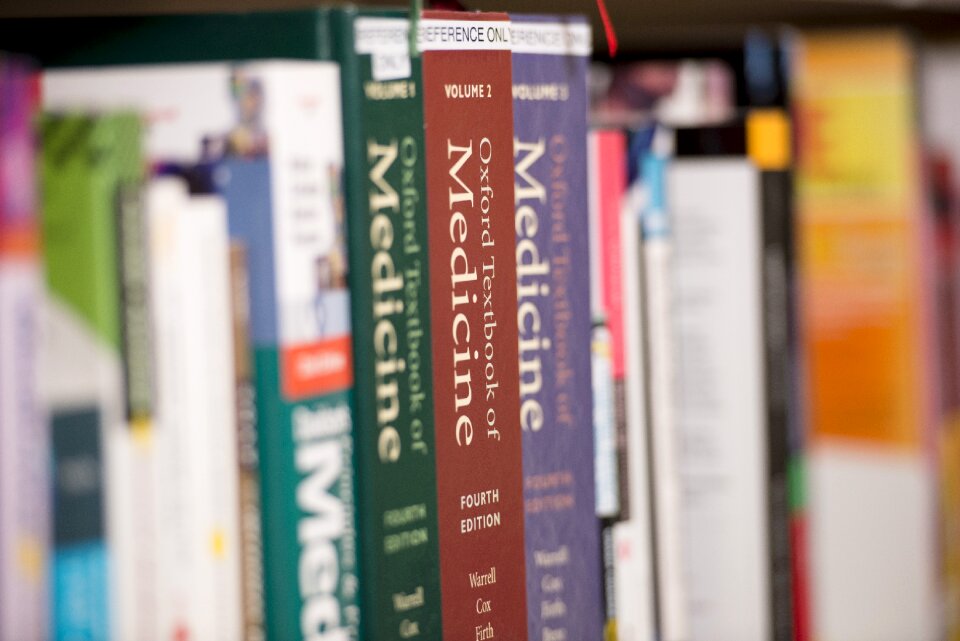 Library books stack studying