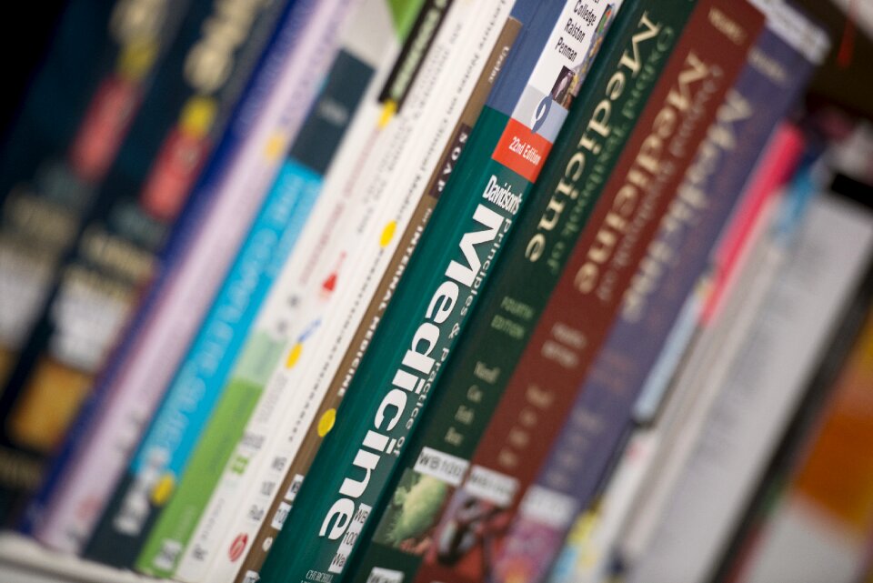 Library books stack studying