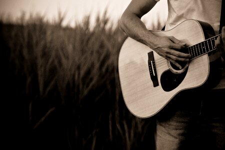 Playing guitar musician brown guitar photo