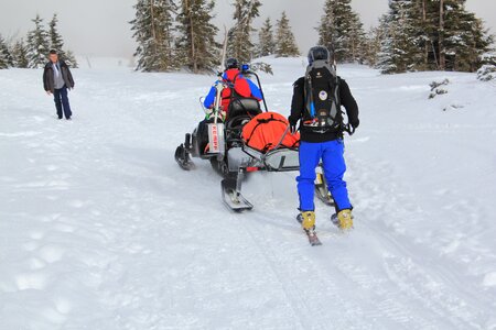 The mountain rescue service snowmobile skis