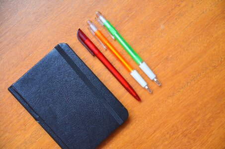 Pencils pens notebook photo