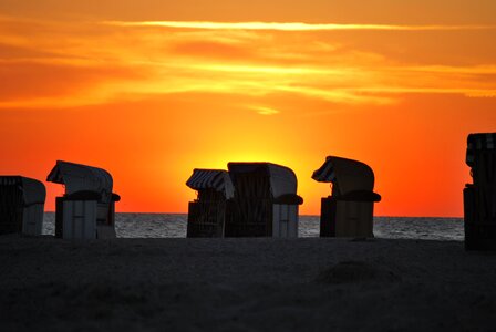 Baltic sea sunset beach chair photo