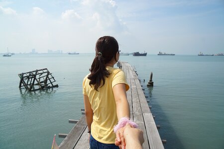 Beach holding hands photo