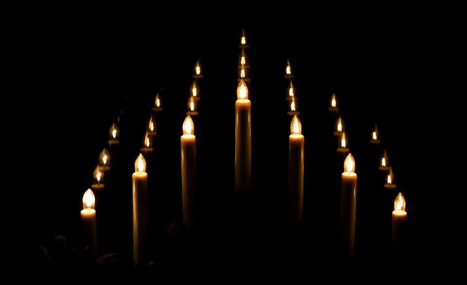 Electric candles reflexion darkness