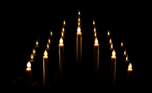 Electric candles reflexion darkness
