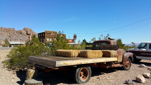 Hay bales on a truck by ghost town blue sky over truck near eldorado canyon nelson nevada