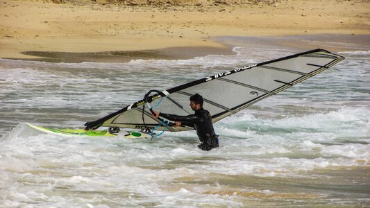 Man sea surfer photo