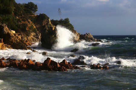The mediterranean sea rocks wind photo