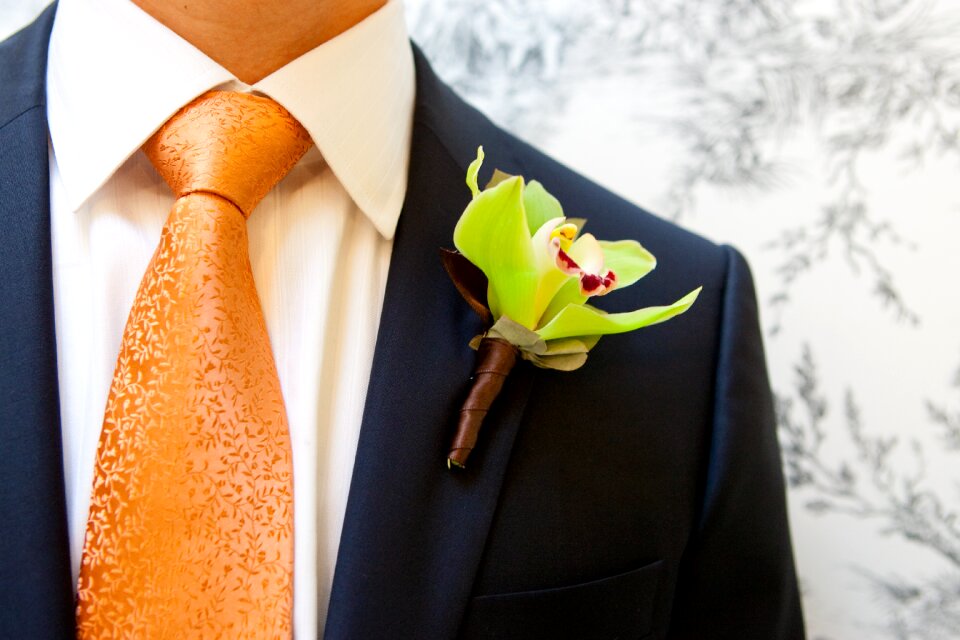 Men's suit orchid boutonniere