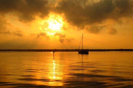 Sun sunset sailboat photo