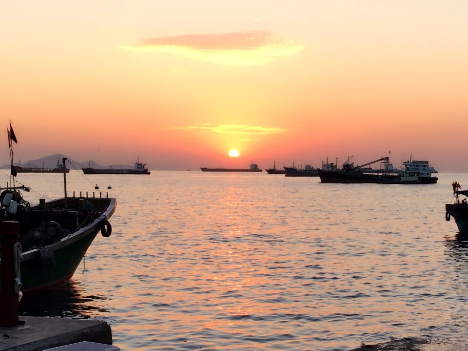 Sunset harbour fishing boats