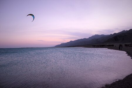 Sunset recreational sports kite surfing photo