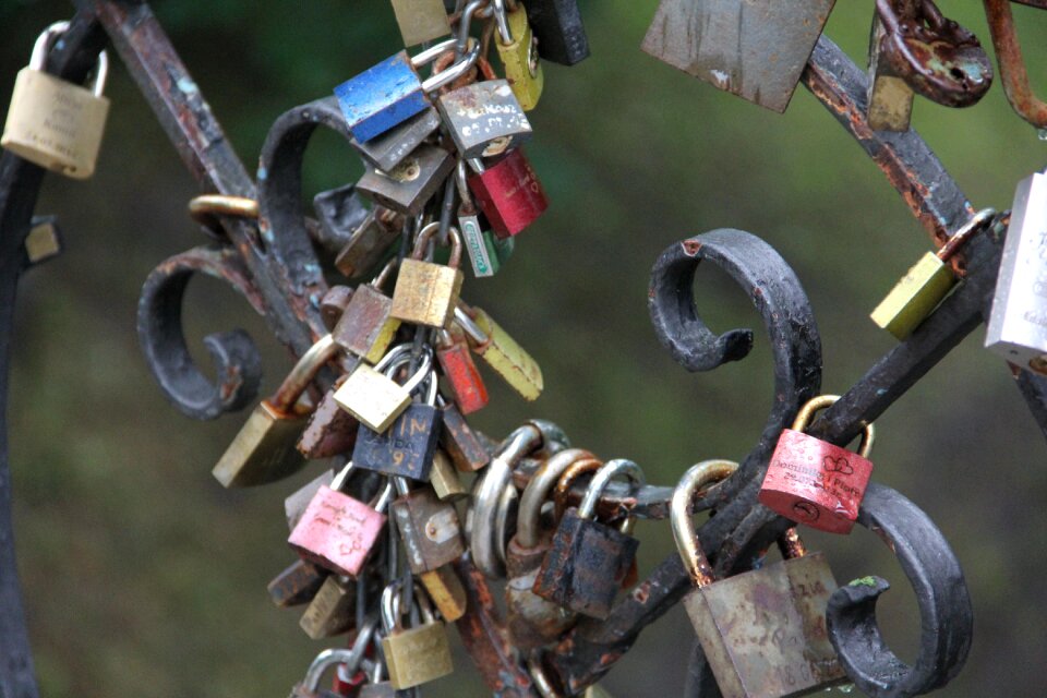 Bridge lovers close padlock of lovers