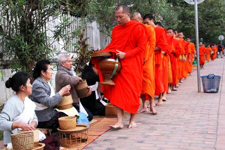 City alms-giving monks photo