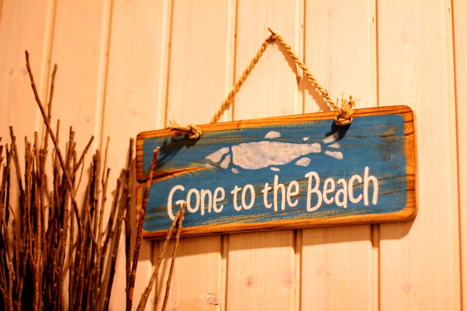 Gone to the beach wood motto