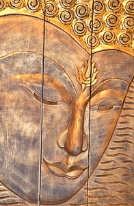 Buddha wall frieze brown wall brown buddha photo