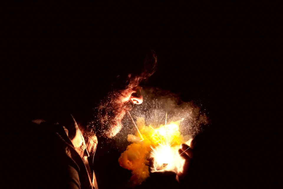 Man smoking smoke explosion cigarette flame